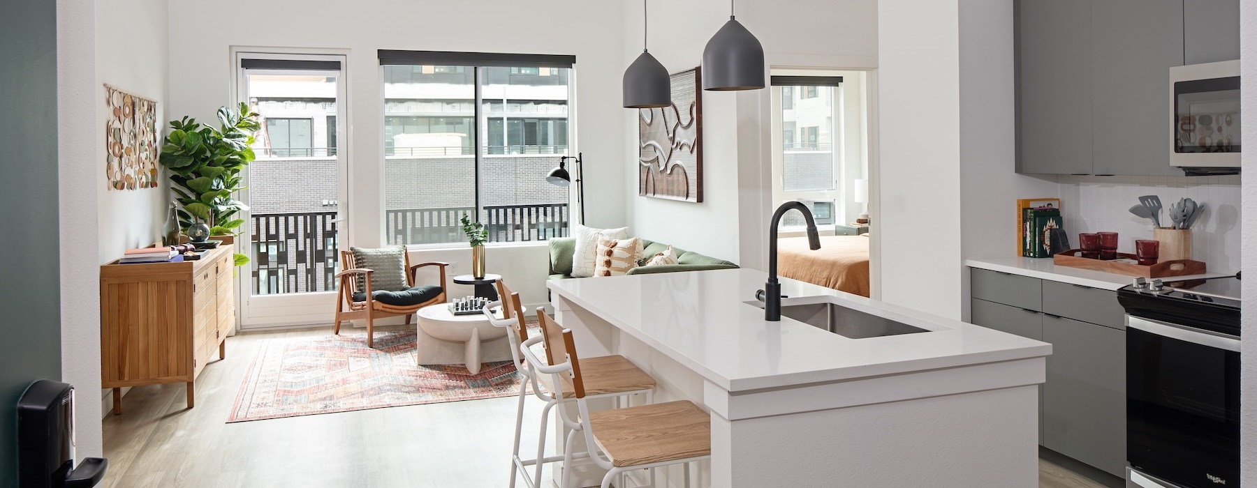 a kitchen with an island and chairs