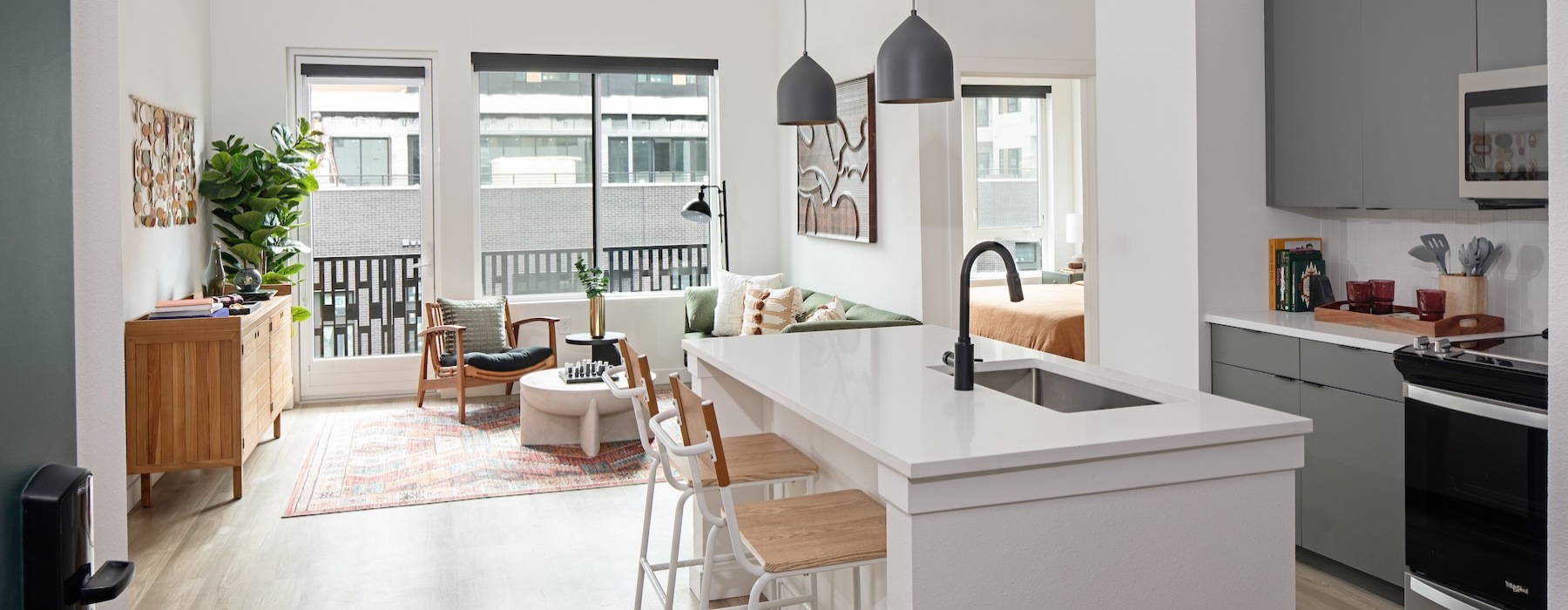 a kitchen with an island and chairs