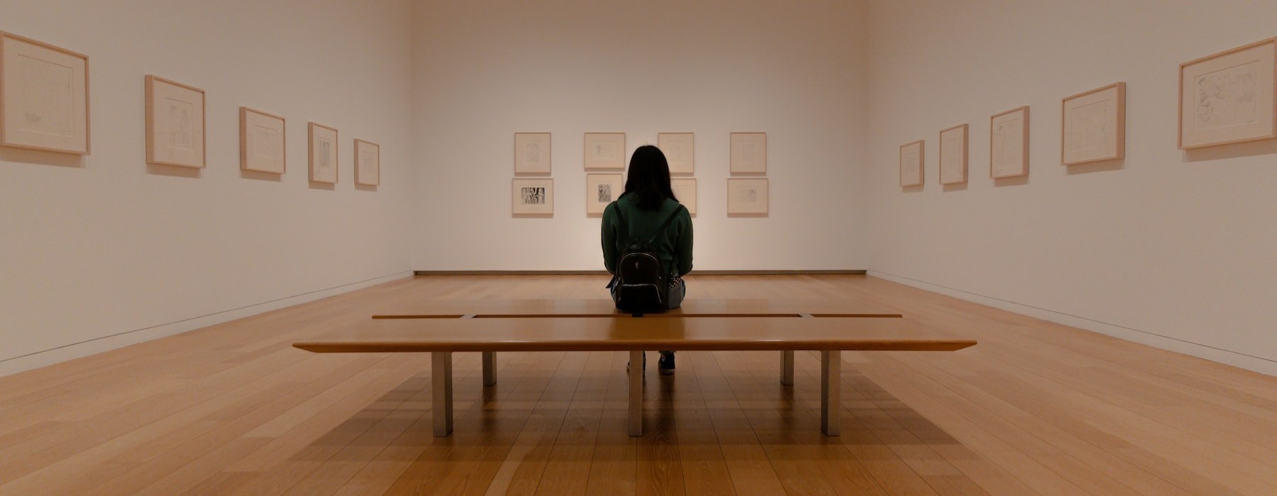 a person sitting in an art gallery